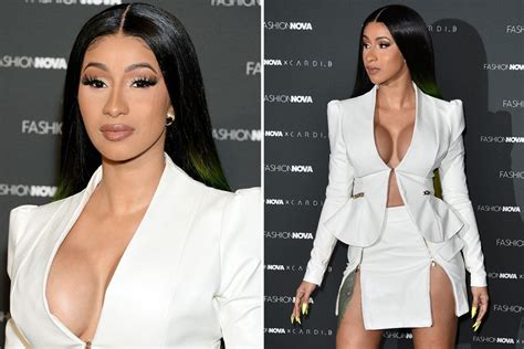 Cardi B Shows Off The Results Of Her New Boob Job In Very Low Cut White Suit For Her Fashion