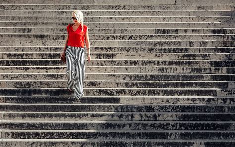 woman going down the stairs by stocksy contributor lumina stocksy