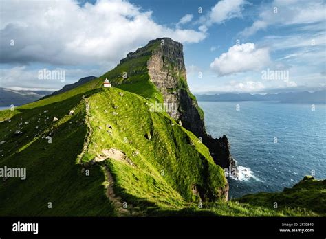 Green Faroese Hills And Kallur Lighthouse On Mountains Of Kalsoy Island