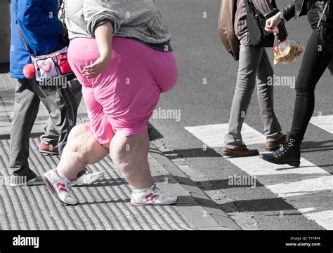 Obese Young Woman Walking In City Centre Stock Photo Alamy