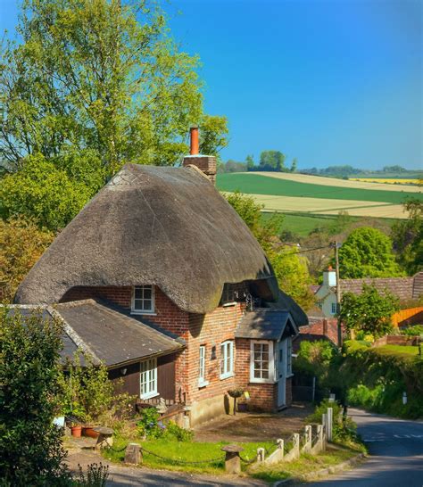 A Pretty Thatched Cottage Above The Village Of Pitton In Wiltshire