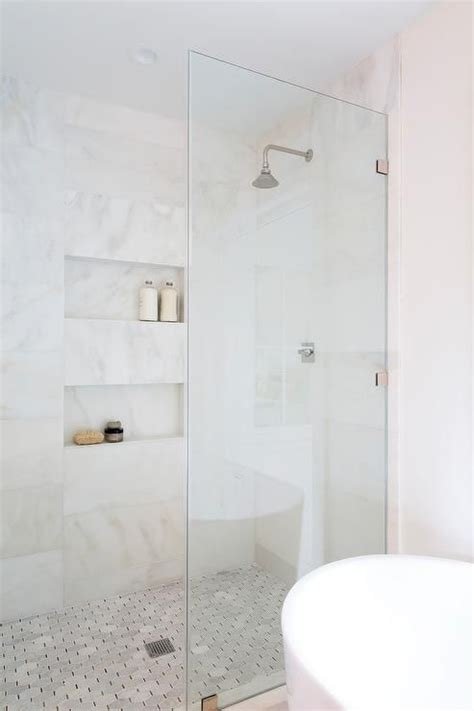 Bathroom tile sizes vary from tiny mosaic tiles to gigantic tiles which can reach meters in length. White and gold marble horizontal wall tiles in a master ...