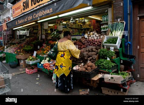 Brixton Market Shops And Stalls With Multicultural Fruit And Veg Stock