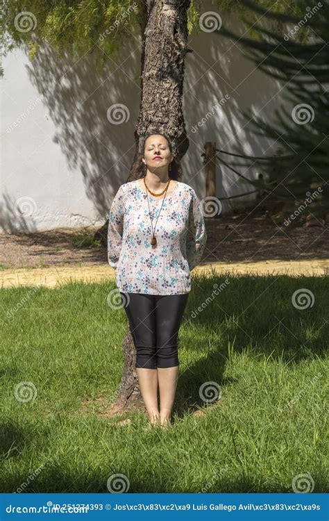 A Woman Sunbathes Hugging A Tree Stock Image Image Of Park Summer