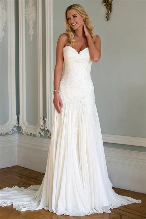 A Strapless Sweetheart Neckline Lace Gown With Chiffon Inserts To The