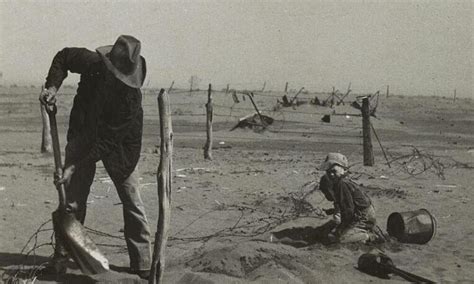 Dust Bowl Farmer Raising Fence To Keep It From Being Buried Under