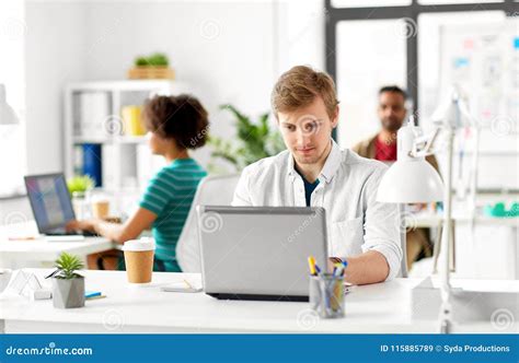 Creative Male Office Worker With Laptop Stock Image Image Of Studio