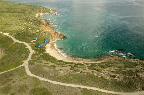 Bird S Eye View Of A Seashore With Pure Turquoise Water And Lodges