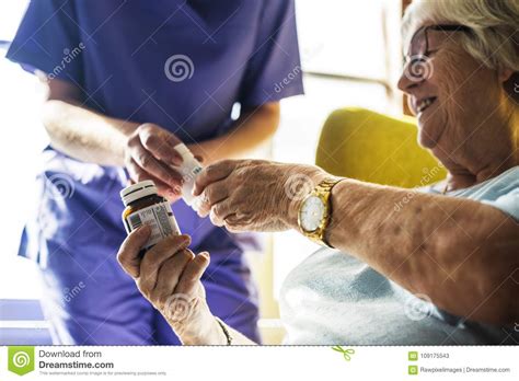 Senior Woman Taking Medicine From The Nurse Stock Image Image Of