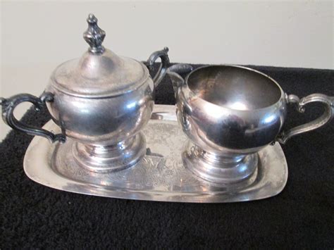 A guitar gig bag is a soft padded gig bag intended for the transport of guitars and for the purpose of storage. WM Rogers Silverplate Creamer and Sugar Bow Set with ...