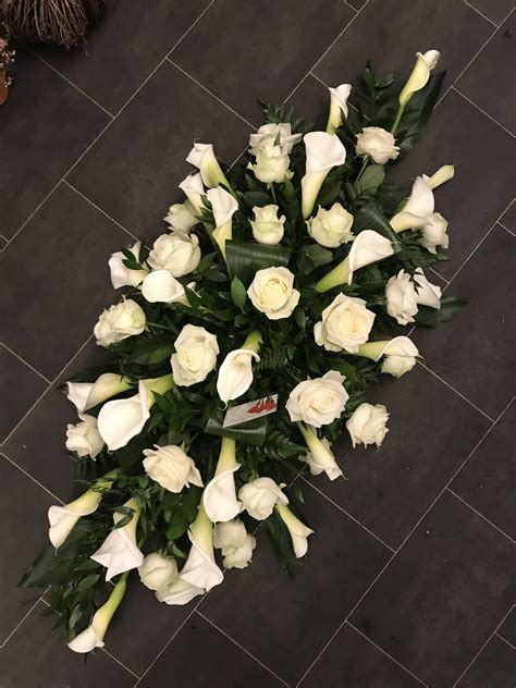 View similar products item #bn781g. White rose and arum calla lily coffin spray funeral ...
