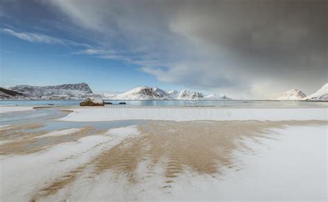Snow Covered Sandy Beach Covered With Little Snow In Norway Stock Photo