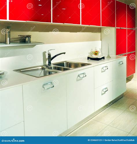 Interior Of Modern Kitchen Equipment White And Red Cabinets Stock