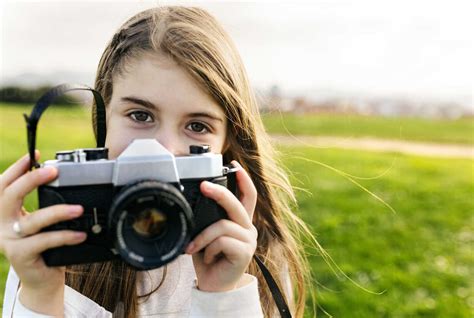 Portrait Of A Girl Holding An Old Fashioned Camera