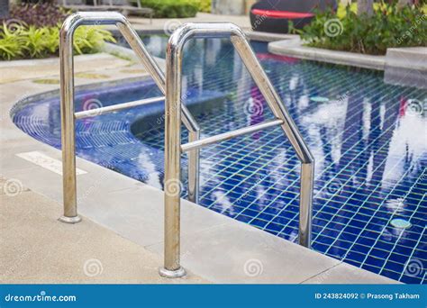 Ladder Stainless Handrails For Descent Into Swimming Pool Stock Photo