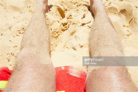 Summer Mans Sandy Legs At Beach Photo Getty Images