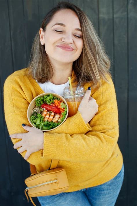 Portrait Of A Cheerful Woman Eating Healthy Salad Concept Of Losing