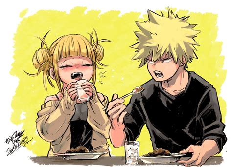 Two People Sitting At A Table With Food In Front Of Them And One