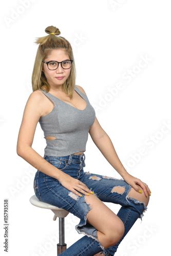 The Girl Poses Sexy Sitting On A Chair Buy This Stock Photo And