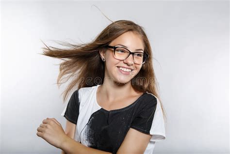Lovely Girl In Glasses With Flying Hair Beautiful Smile Positive