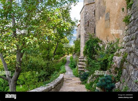 A Lush Mountainside Path Around The Medieval Walled Village Of Gourdon