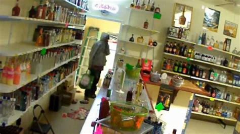 Men Caught On Camera Stealing 5k In Liquor Through Hole In Wall