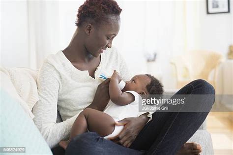 African American Baby With Bottle Photos And Premium High Res Pictures