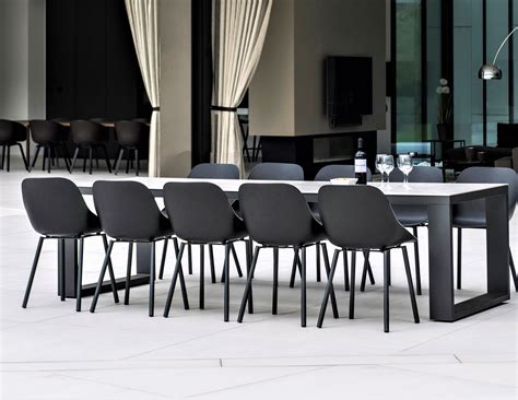 Design the perfect patio dining space with this fantastic rectangular illusion outdoor dining table. Abonne Carrara Ceramic Extendable Dining Table - Couture ...