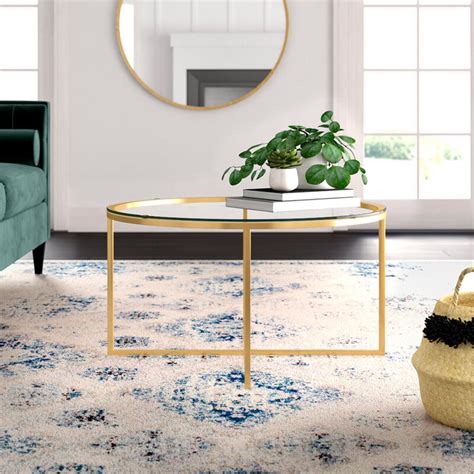 Clear acrylic coffee table $ 95.00; Mistana™ Wasser Cross Legs Coffee Table & Reviews | Wayfair