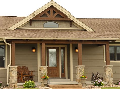 Color! Accent shingle peak.... Front porch with timber posts and