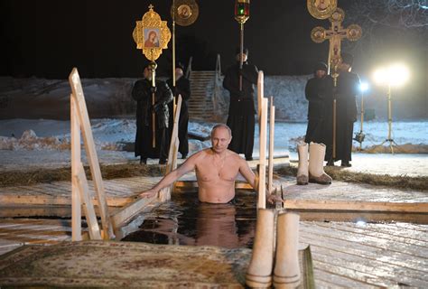 Shirtless Russian President Vladimir Putin Plunges Into Icy Waters To