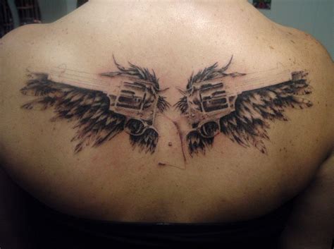 Angel wings with halo tattoo can represent guidance, insight, and hope. angel wings with guns tattoos | Foot Tattoos Design