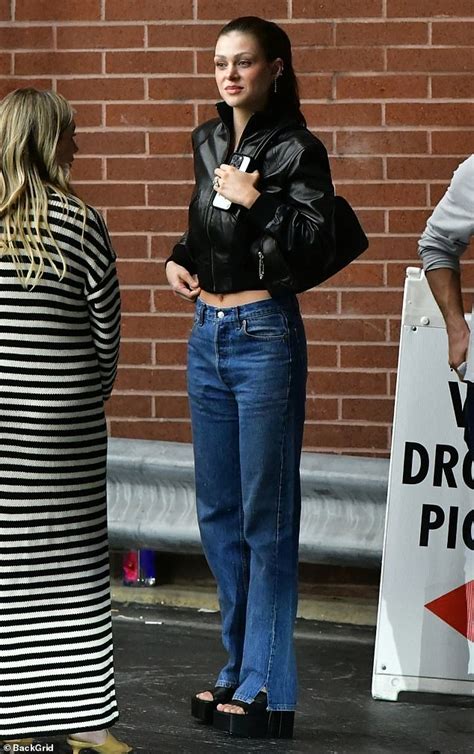 Nicola Peltz Displays A Glimpse Of Her Toned Midriff In A Cropped Jacket And Jeans As She And