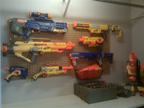 Building a nerf gun wall display out of peg board has never been easier than it is now. Nerf gun rack, what more can you say. | Unschooling is ...