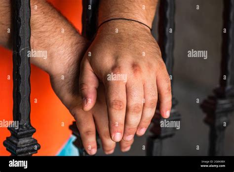 Prisoner Male Holding Hands On Jail Bars Hands On Prison Bars Stock