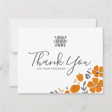 A Thank Card With An Orange Flower On The Front And Gray Lettering That