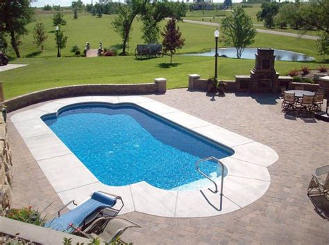 The average cost per square foot ranges between $16 and $24. kansas_outdoor_living_paver_patio_around_pool_with ...