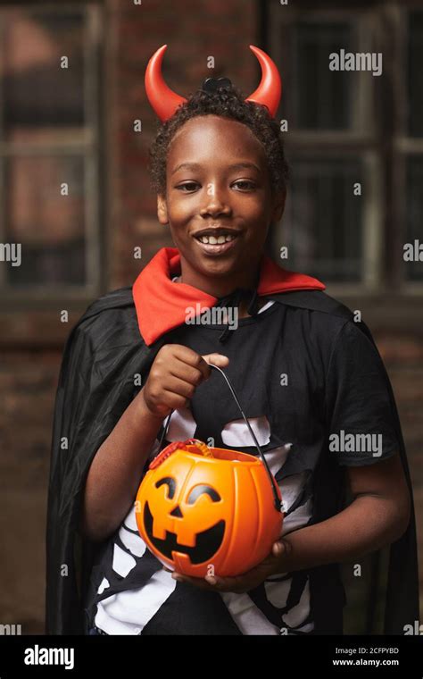 Vertical Medium Portrait Of Happy African American Boy Dressed Up As
