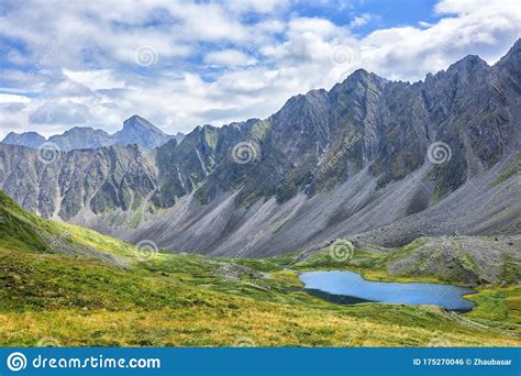 Siberian Alpine Tundra Against Backdrop Of Mountain Range Stock Photo
