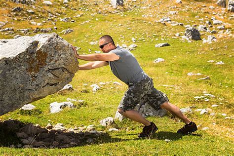 Man Pushing Rock Stock Photos Pictures And Royalty Free Images Istock