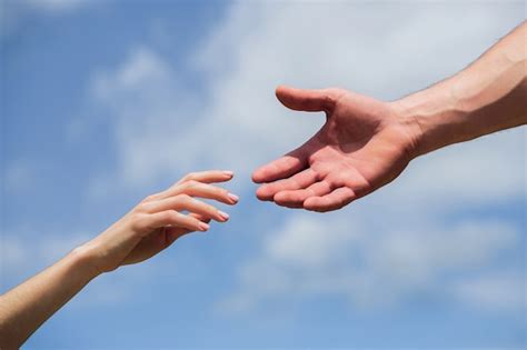 Premium Photo Hands Of Man And Woman Reaching To Each Other Support