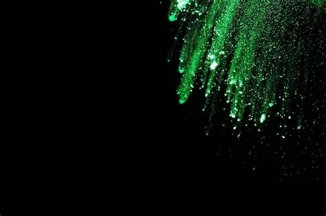 Premium Photo Abstract Green Dust Explosion On Black Background