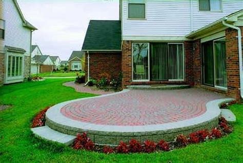 Dig out the patio layout. How to Build a Raised Patio Out of Brick Pavers | Hunker