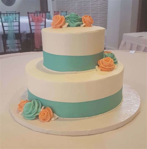 Wedding Cake With Blue And Orange Flowers Wedding Cakes Minneapolis
