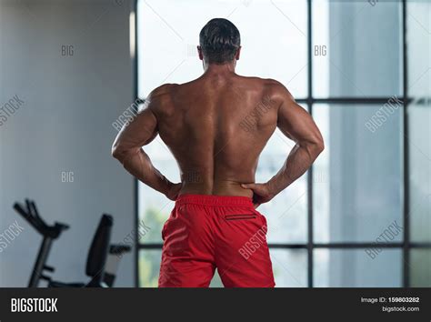 Muscular Man Flexing Back Muscles Image And Photo Bigstock