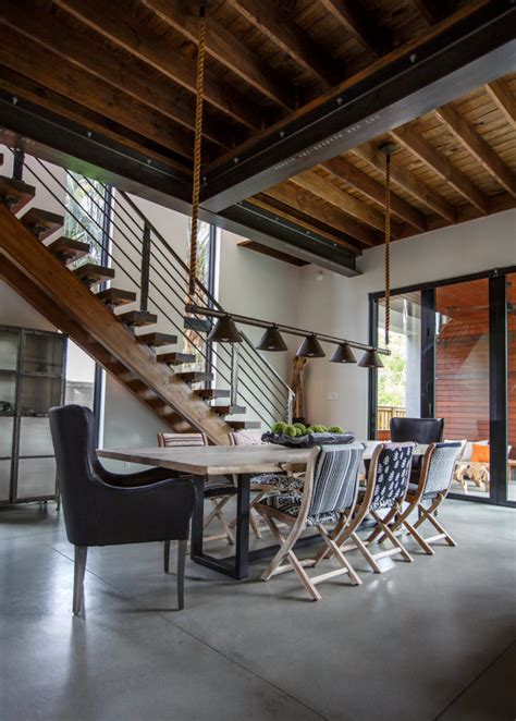 Industrial style incorporates rough metal, concrete, cinder block, cables, bolts and exposed brick in both the architecture and decor. Florida House With Industrial Interior Design You Can't Miss!