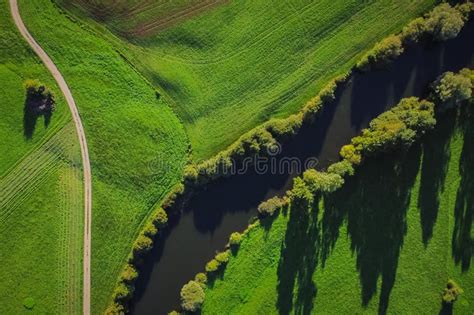 Vertical Aerial View Of Unica Or Unec River On Planinsko Polje Field In