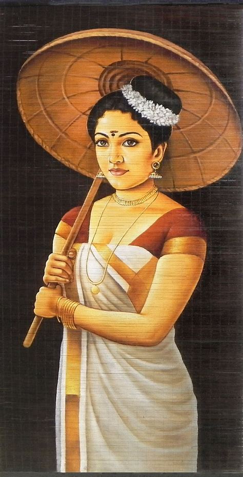 A Malayalee Lady In A Traditional Dress Holding Bamboo Umbrella Wall