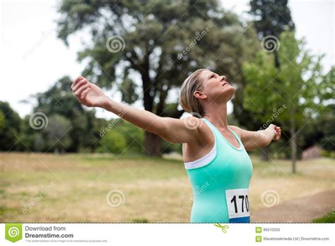 Female Athlete With Arms Outstretched In Park Stock Image Image Of