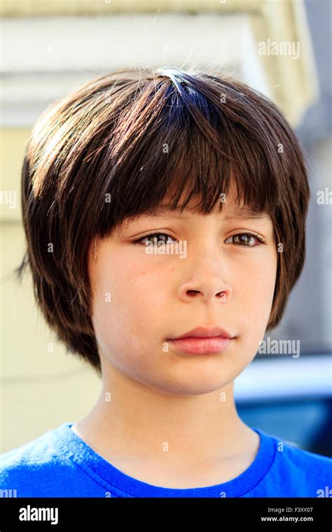 Brown Haired Caucasian Child Boy 9 10 Year Old Standing Outdoors In